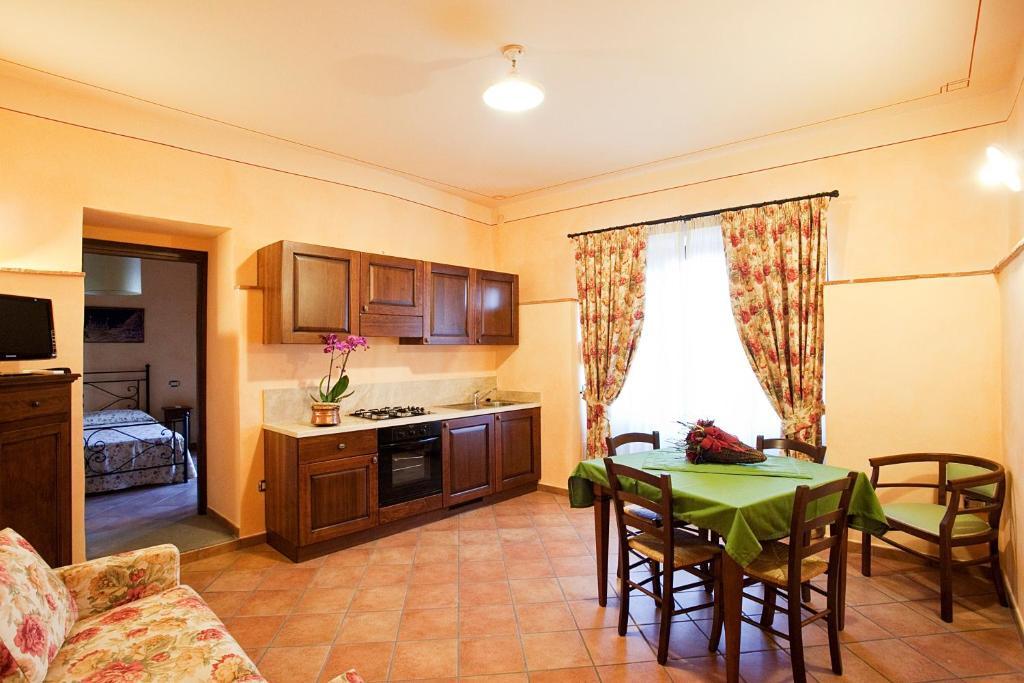 Aparthotel Residenza Palazzo Saloni à Montalcino Chambre photo